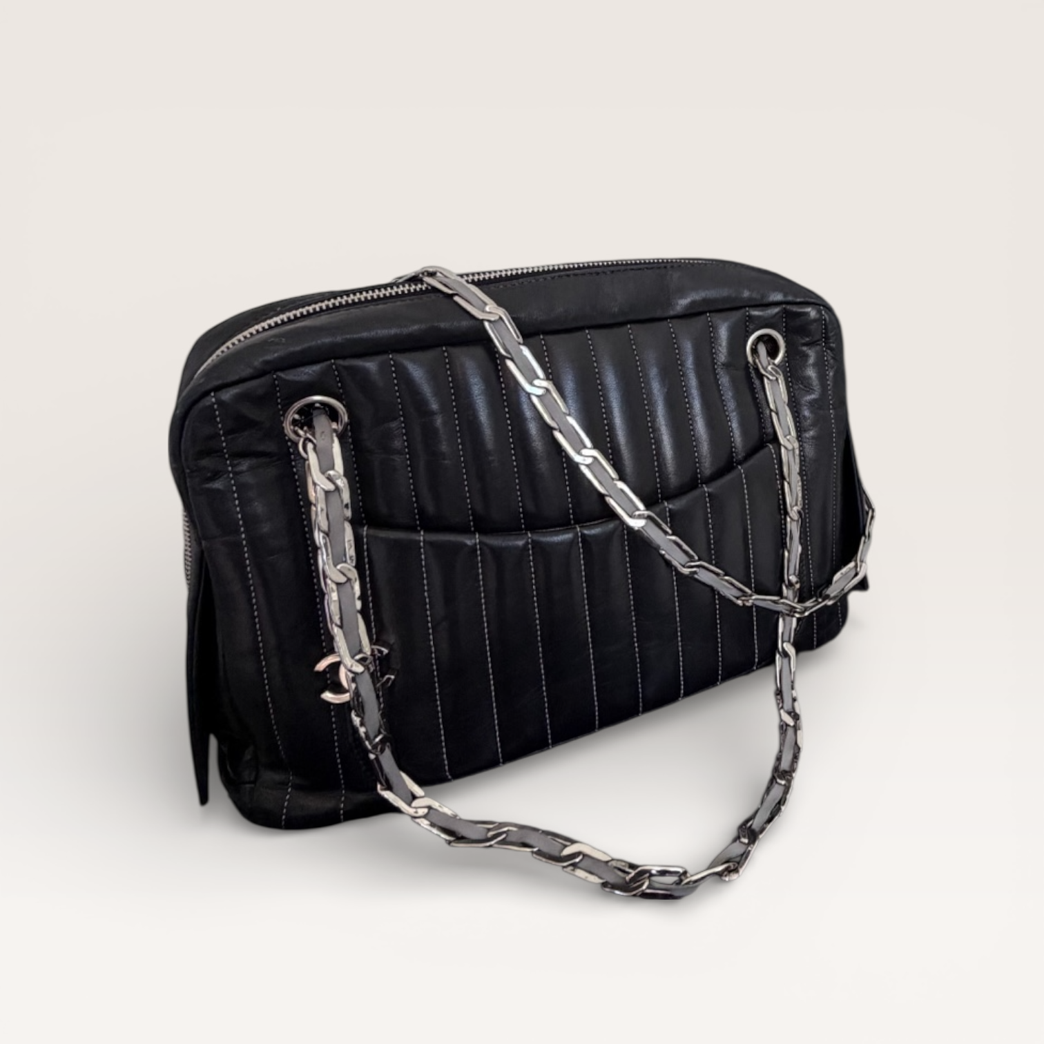 Chanel black quilted leather shoulder bag with silver chain strap, angled front view