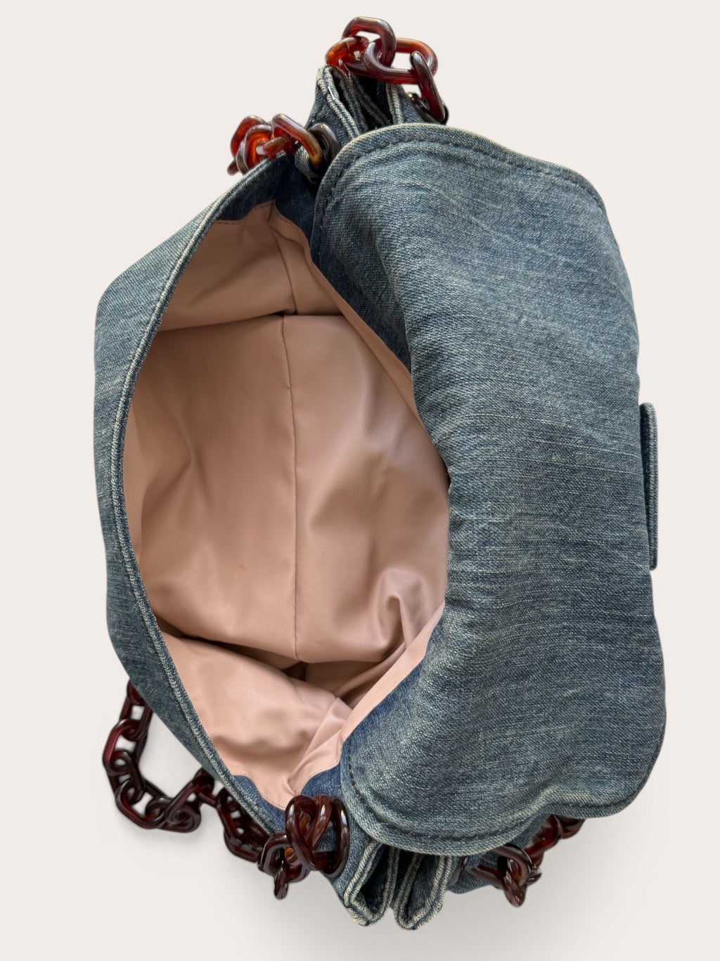 Interior of back pocket Prada bag