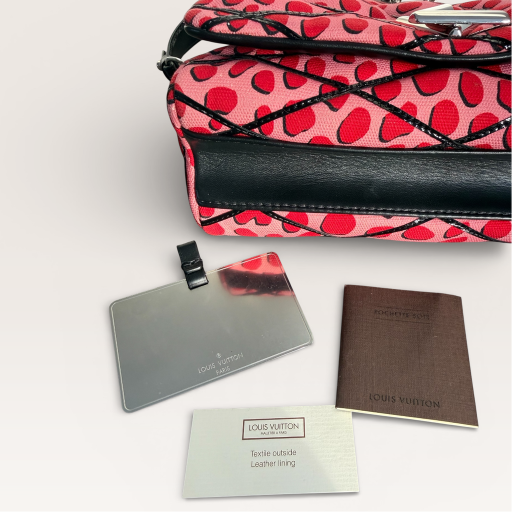 Louis Vuitton LV Twist Jungle Dot Canvas shoulder crossbody bag in pink and red dots bottom view With authenticity cards and tags