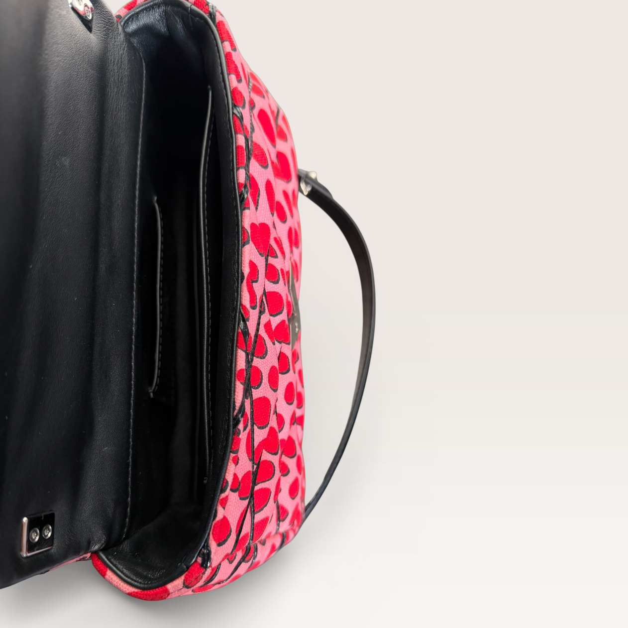 Louis Vuitton LV Twist Jungle Dot Canvas shoulder crossbody bag in pink and red dots interior view