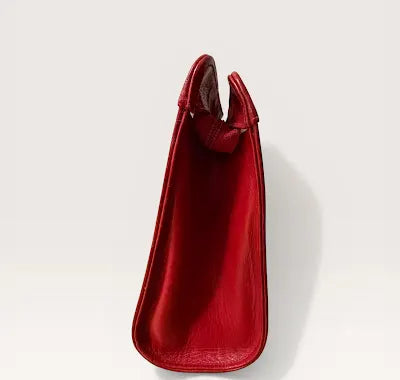Red and clear Chanel clutch side view