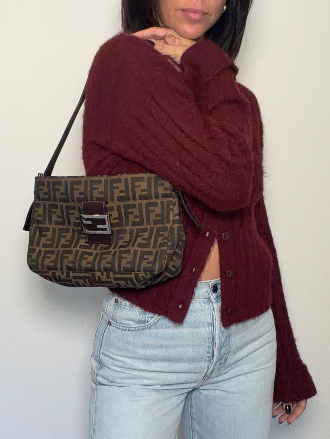 Women holding a vintage Fendi Zucca baguette