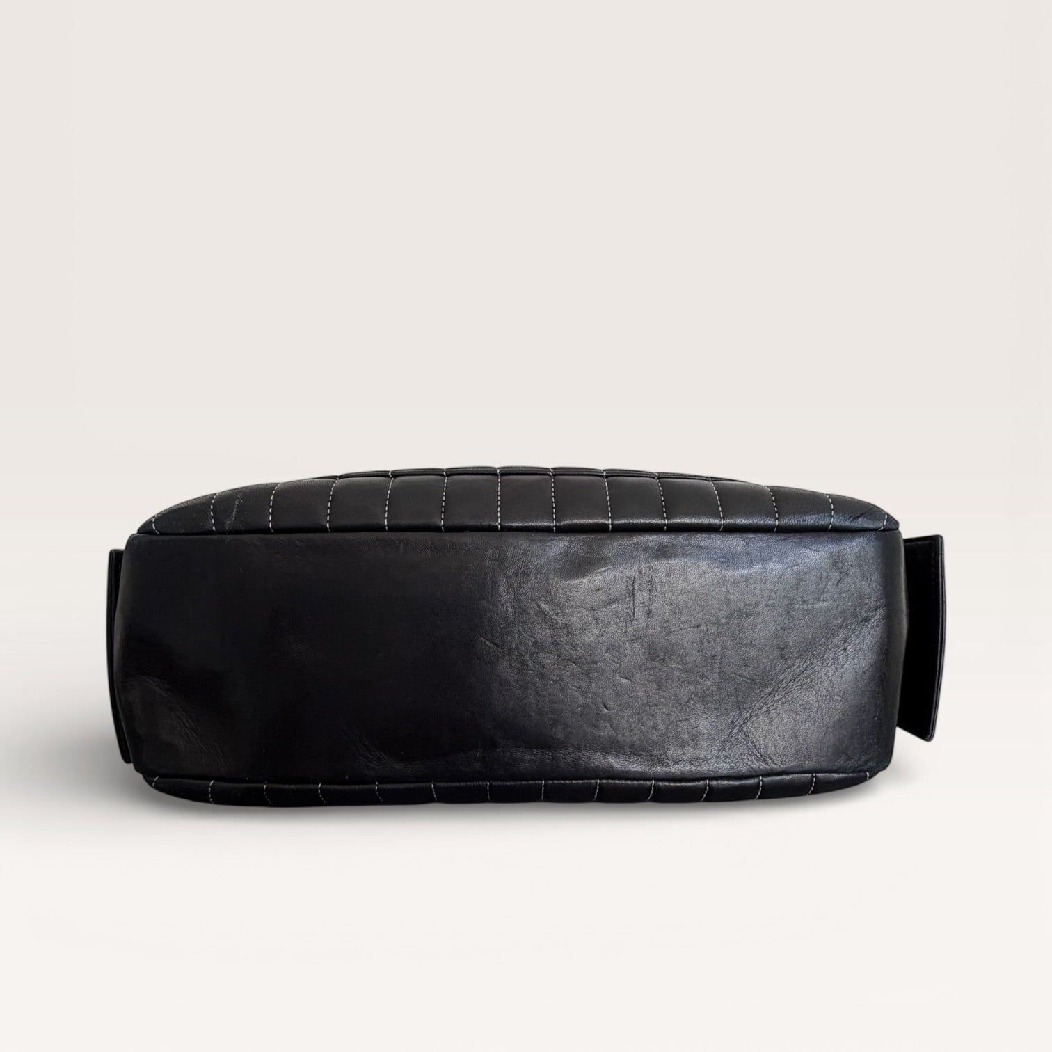 Chanel black leather shoulder bag bottom base showing structure and condition