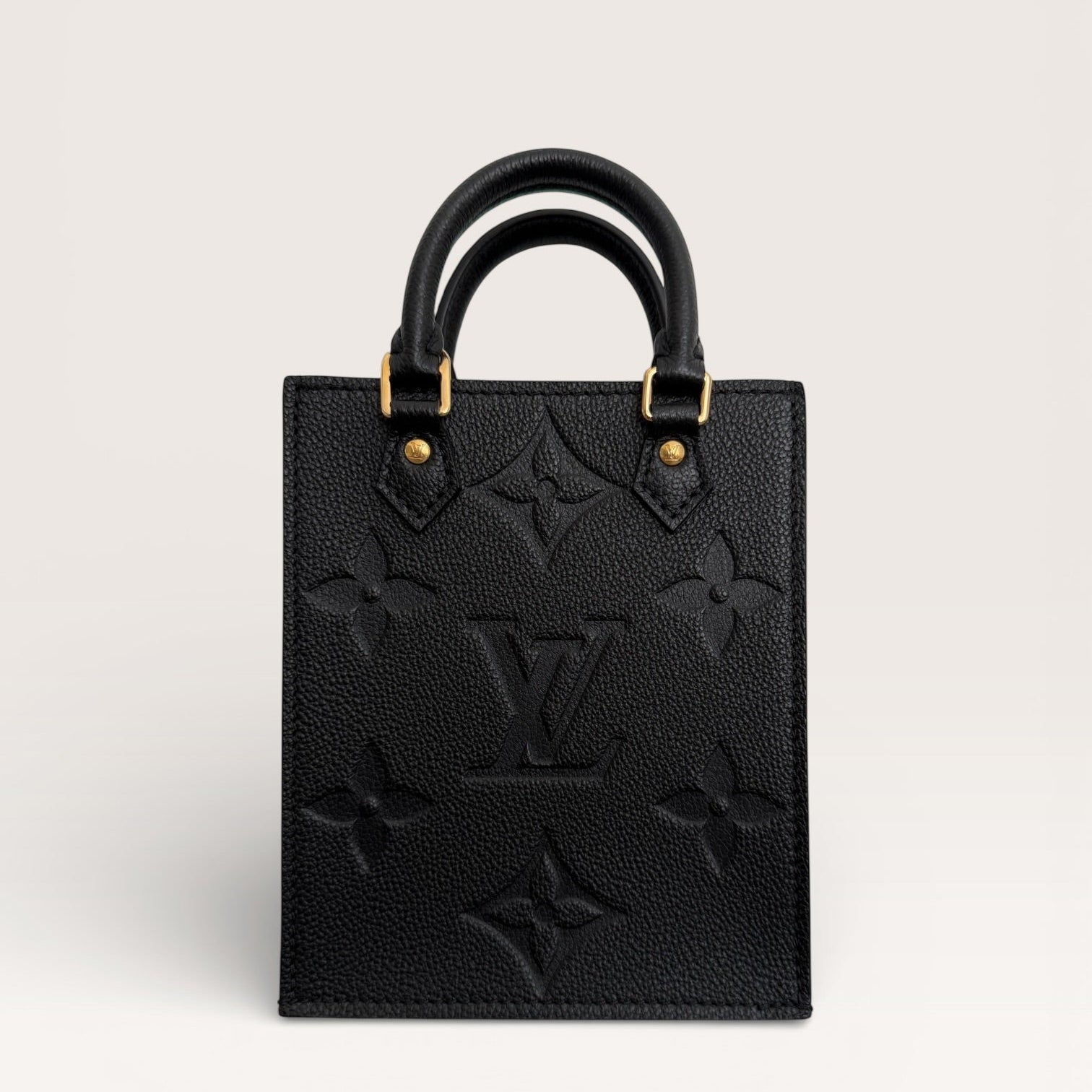 Louis Vuitton petit sac plat black empreinte mini tote front view 